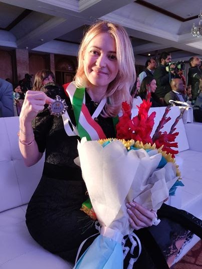 Image may contain: one or more people and flower