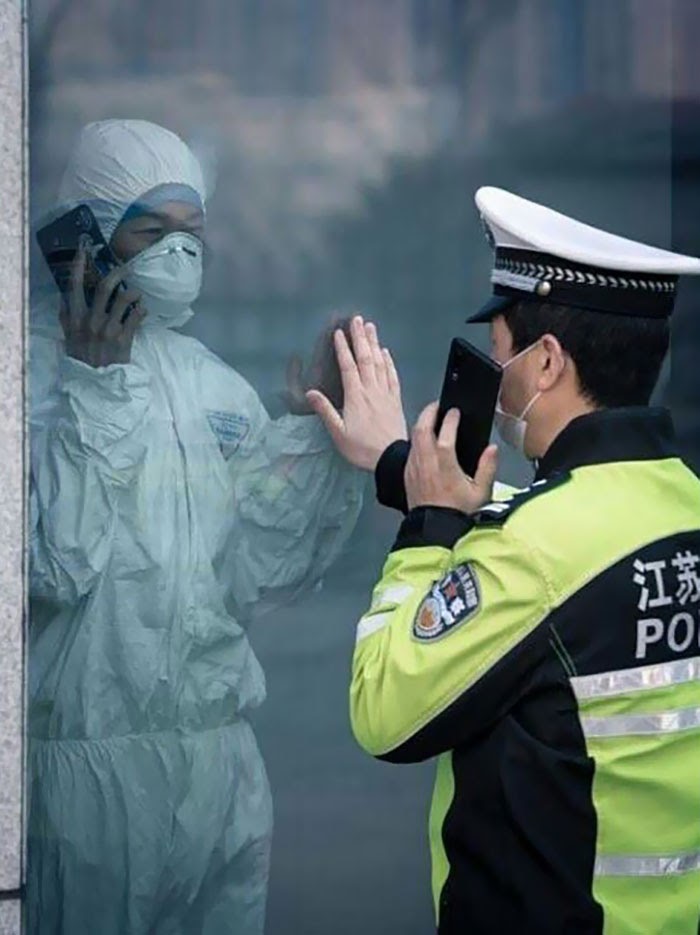 Husband And Wife On First Line Of Defense Against Coronavirus. Finally Meet For Couple Minutes