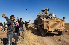 Image result for Russian, Turkish armored vehicles pelted with rocks, shoes as joint patrol enters Kurdish area of northern Syria