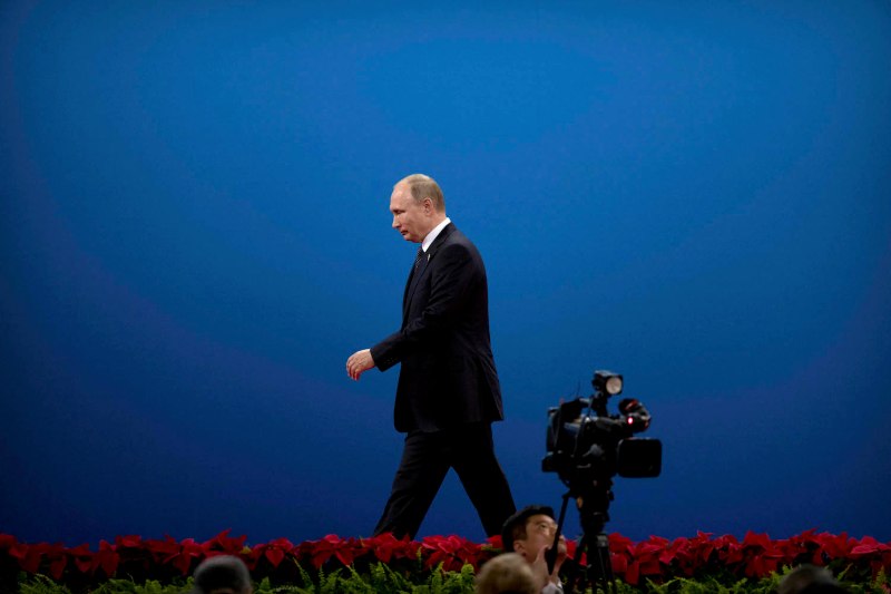 Russian President Vladimir Putin leaves the stage after speaking during the opening ceremony of the Belt and Road Forum at the China National Convention Center in Beijing on May 14, 2017.